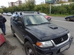 Багажник Thule на аэродинамических дугах для Mitsubishi Pajero Sport