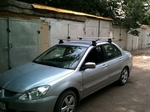 Багажник Thule на аэродинамических дугах для Mitsubishi Lancer