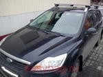 Багажник Thule на аэродинамических дугах для Ford Focus