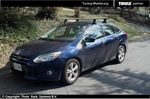 Багажник Thule на аэродинамических дугах для Ford Focus