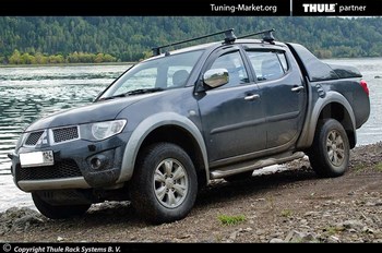 Багажник Thule на стальных дугах для Mitsubishi L200 - ОбвесКарРу VIN: 769-754-1400. 